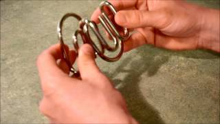 Double M Metal Ring Puzzle SOLUTION [upl. by Enelec]