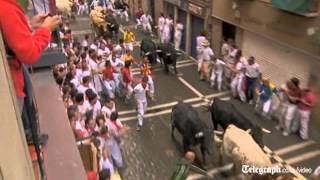 Running of the bulls in Spains Pamplona begins [upl. by Leinehtan]